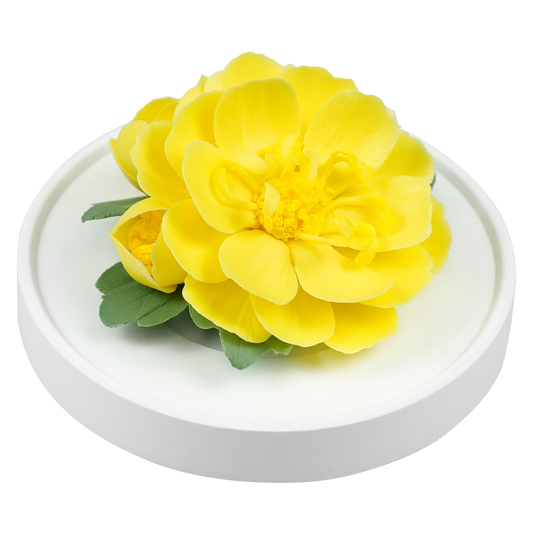 Luxury ceramic flower scent diffuser for home in yellow, ranunculus , displayed from side