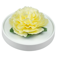 Luxury ceramic flower scent diffuser for home in yellow, carnation, displayed from side