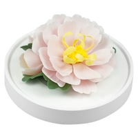 Luxury ceramic flower scent diffuser for home in pink, tree peony, displayed from side