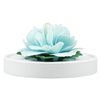 Luxury ceramic flower scent diffuser for home in pale blue, peony, displayed from front