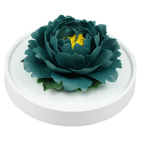 Luxury ceramic flower scent diffuser for home in dark green, peony, displayed from side